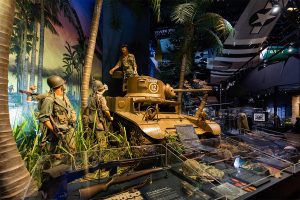 three mannequins in jungle scene