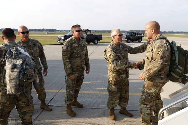 Brig. Gen. Mark E. Anderson, Wisconsin's deputy adjutant general for Army, Chief Warrant Officer 5 William D. Krueck, the state's command chief warrant officer, and Command Sgt. Maj. Rafael Conde, the Wisconsin Army National Guard’s senior enlisted advisor, welcome back Soldiers of 2nd Battalion, 127th Infantry, 32nd Infantry Brigade Combat Team at Volk Field Air National Guard Base as they return following a deployment to support hurricane relief operations, Sept. 16, 2017. On Sept. 8, Wisconsin Gov. Scott Walker signed an executive order, which authorized the adjutant general to call elements of the Wisconsin National Guard to state active duty, as necessary. The 32nd IBCT and select other Wisconsin National Guard units were called to state active duty to assist Florida. 112th Mobile Public Affairs Detachment photo by Spc. Jared Saathoff/Released.The appearance of U.S. Department of Defense (DoD) visual information does not imply or constitute DoD endorsement. 3781928. Public domain.