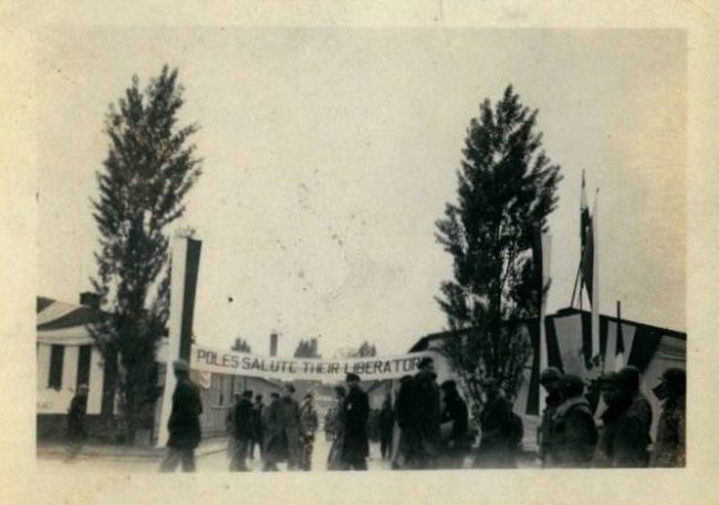 Photo of The "Poles Salute Their Liberators" banner was seen at Buchenwald after liberation.