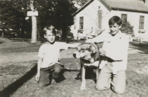 Boys and their dog, Brownie. Oren Kendley is at right.