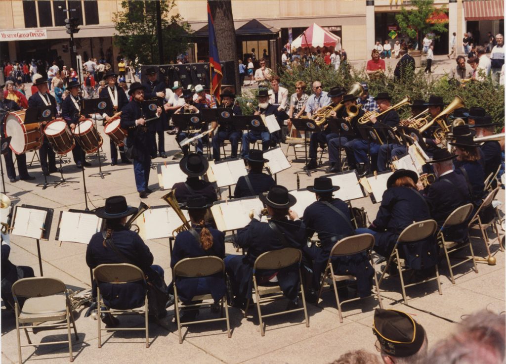 musicians in a circle outdoors