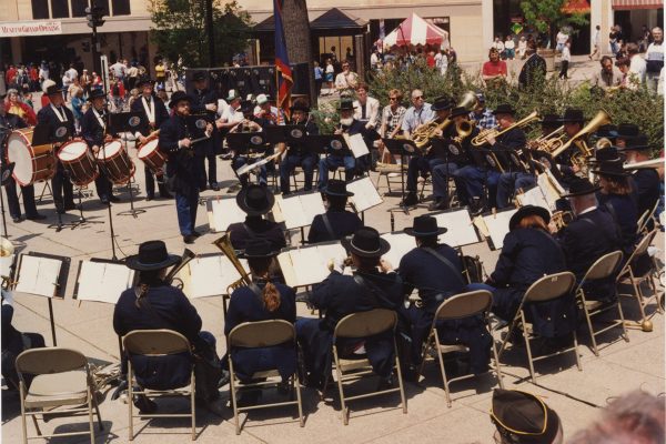 musicians in a circle outdoors