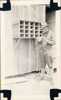 Lawrence took this photo of a fellow soldier, R.E. Mauger, reading mail from home while training at Fort Sheridan.
