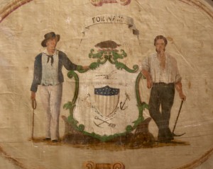 The seal painted on the reverse makes this one of the earliest known flags still in existence to bear the Seal of Wisconsin.