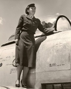 Jeanette Kapus posing on the wing of an F-86 Sabre.