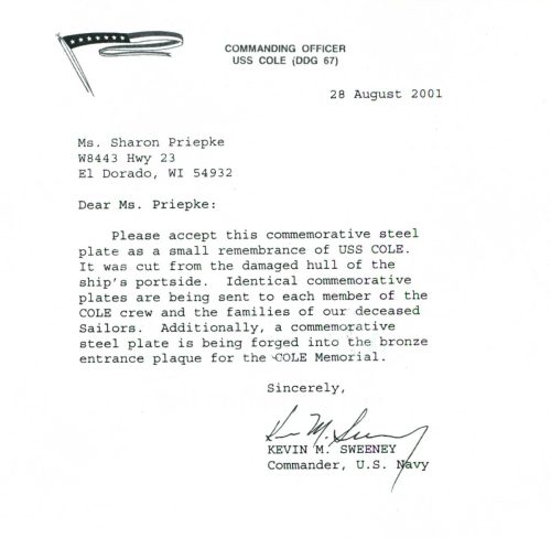 Hull fragment of the USS Cole presentation letter