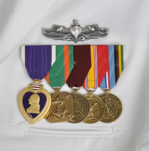 Pin: Enlisted Surface Warfare Specialist. Medals:  Purple Heart, Navy Achievement Medal, Good Conduct Medal, National Defense Service Medal, Armed Forces Expeditionary Meda